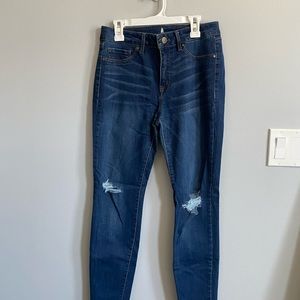 Distressed dark wash skinny jeans